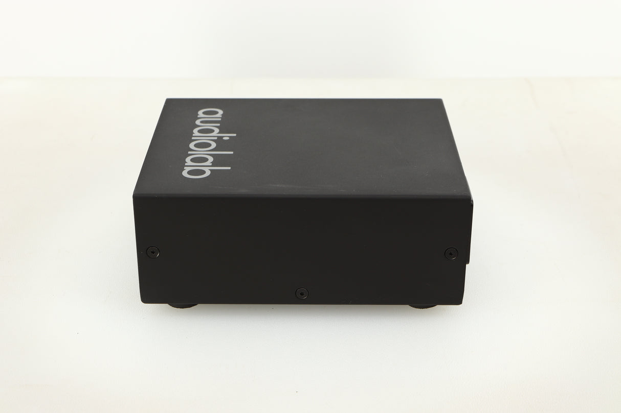Side view of a used Audiolab DC Block Mains Filter in Black finish