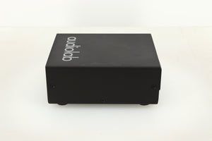 Side view of a used Audiolab DC Block Mains Filter in Black finish