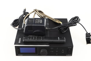 Top of a used Audiolab M-DAC Digital Analogue Converter in a black finish showing Remote, PSU, Manual and USB Cable