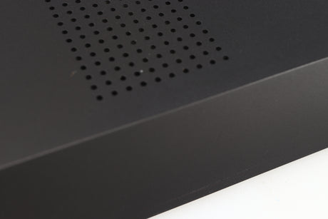 Close up of a used Audiolab M-DAC Digital Analogue Converter in a black finish showing light scratch