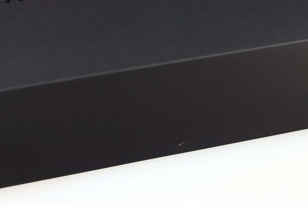 Close up of a used Audiolab M-DAC Digital Analogue Converter in a black finish showing small scratch