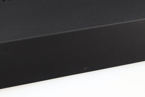 Close up of a used Audiolab M-DAC Digital Analogue Converter in a black finish showing small scratch