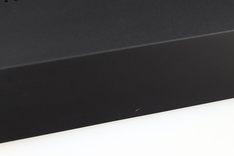 Close up of a used Audiolab M-DAC Digital Analogue Converter in a black finish showing small scratch