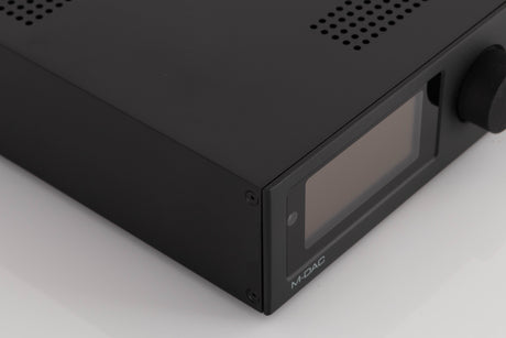Front left corner of a used Audiolab M-DAC Digital Analogue Converter in a Black finish