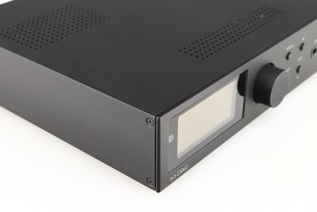 Front left corner of a used Audiolab M-DAC Digital Analogue Converter in a black finish