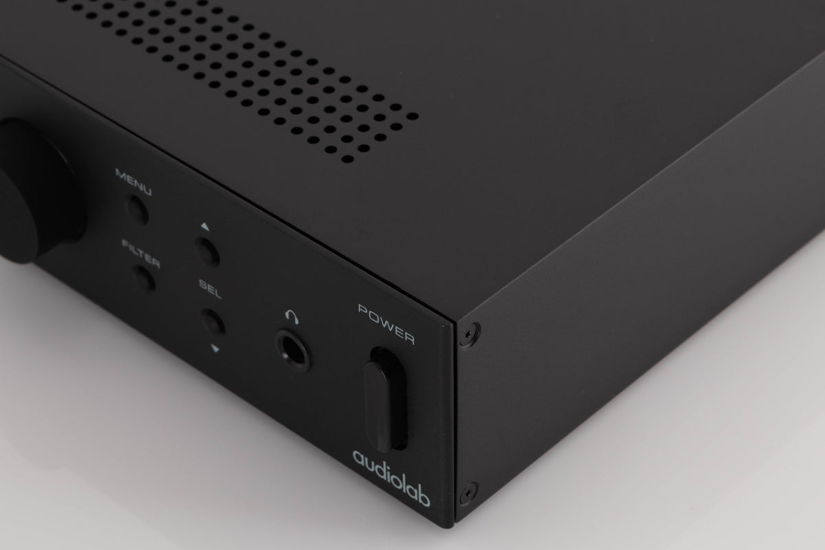 Front right corner of a used Audiolab M-DAC Digital Analogue Converter in a Black finish