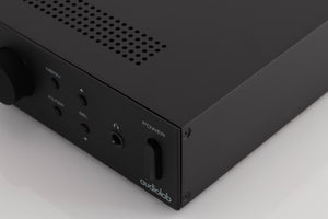 Front right corner of a used Audiolab M-DAC Digital Analogue Converter in a Black finish