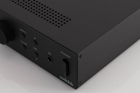 Front right corner of a used Audiolab M-DAC Digital Analogue Converter in a Black finish