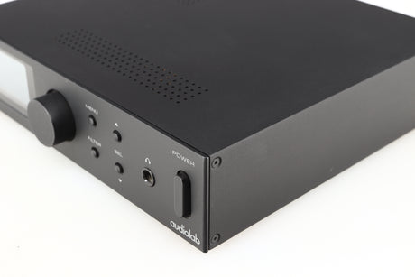 Front right corner of a used Audiolab M-DAC Digital Analogue Converter in a black finish
