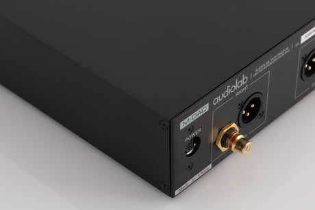 Rear right corner of a used Audiolab M-DAC Digital Analogue Converter in a Black finish