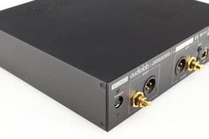Rear right corner of a used Audiolab M-DAC Digital Analogue Converter in a black finish