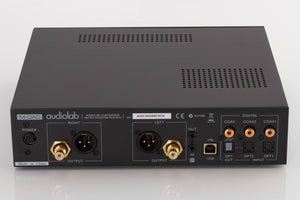 Rear view of a used Audiolab M-DAC Digital Analogue Converter in a Black finish showing Power Input, Optical Inputs, Optical Output, Coaxial Inputs, USB Input and XLR Outputs