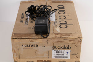 Box for a used Audiolab M-DAC Digital Analogue Converter in a Black finish showing PSU