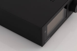 Front left corner of a used Audiolab M-DAC Digital Analogue Converter in a Black finish
