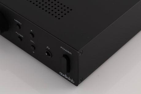 Front right corner of a used Audiolab M-DAC Digital Analogue Converter in a Black finish