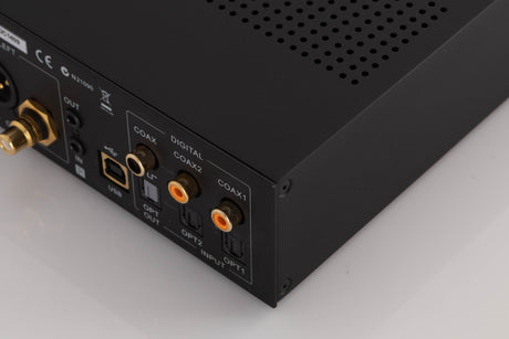 Rear left corner of a used Audiolab M-DAC Digital Analogue Converter in a Black finish