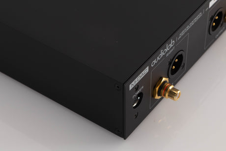 Rear right corner of a used Audiolab M-DAC Digital Analogue Converter in a Black finish