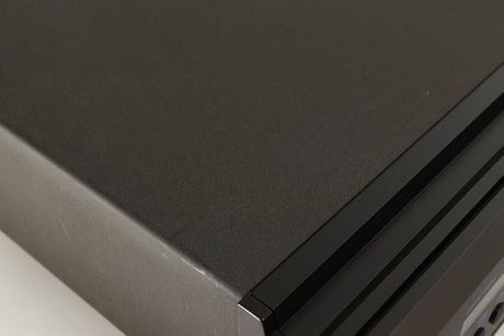Close up of a used AVI Laboratories S2000MC CD Player showing some scratching on top