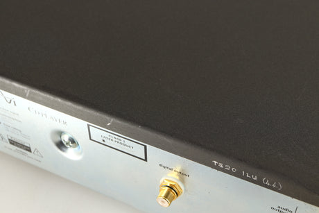 Close up of a used AVI Laboratories S2000MC CD Player showing some scratching on top
