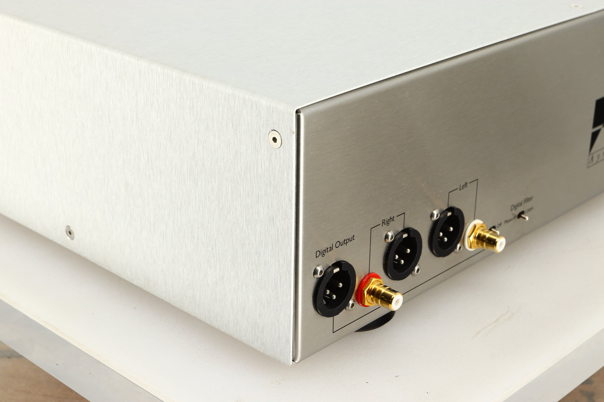 Rear left corner view of a used Ayre CX-7 CD Player in silver finish 