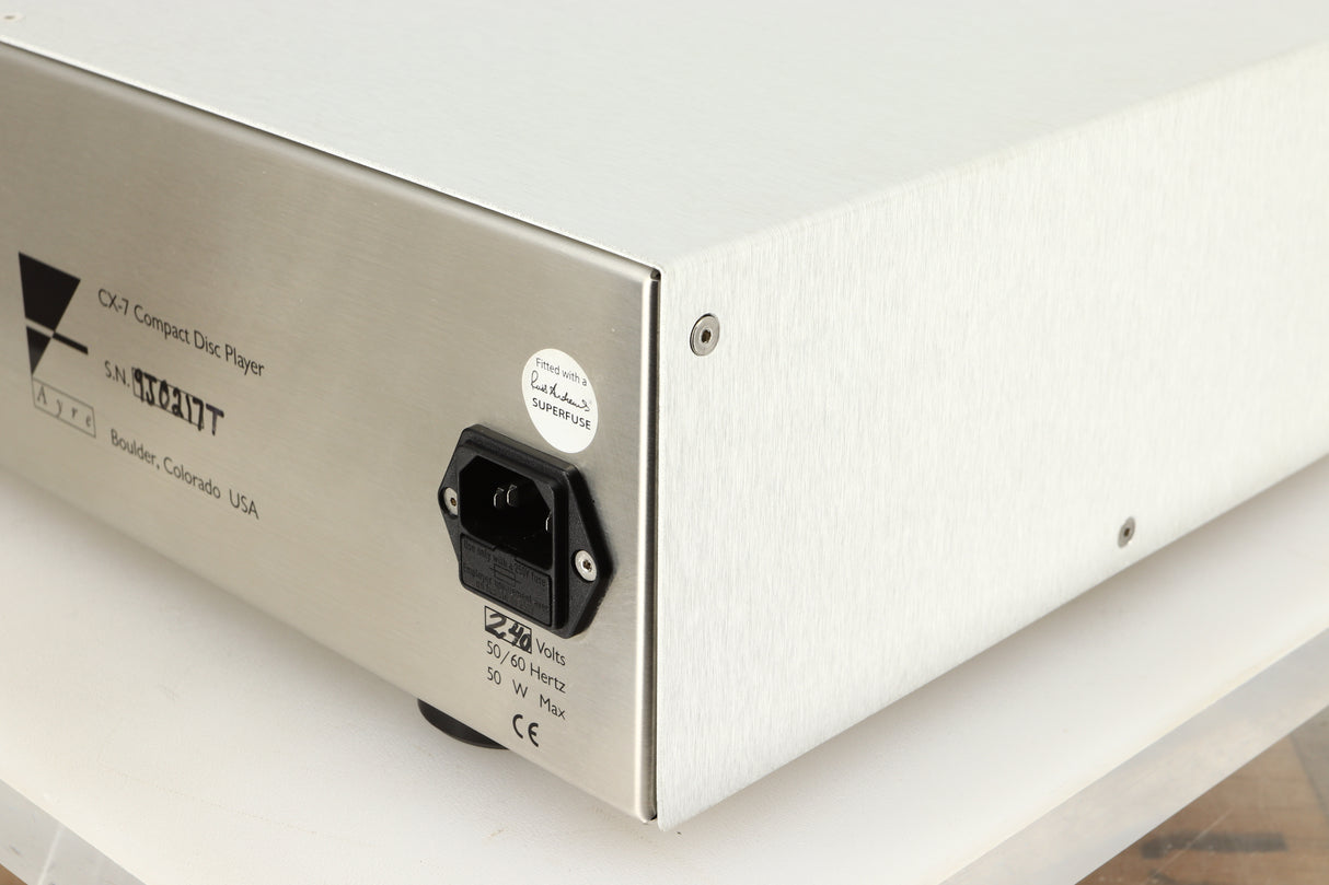Rear right corner view of a used Ayre CX-7 CD Player in silver finish 