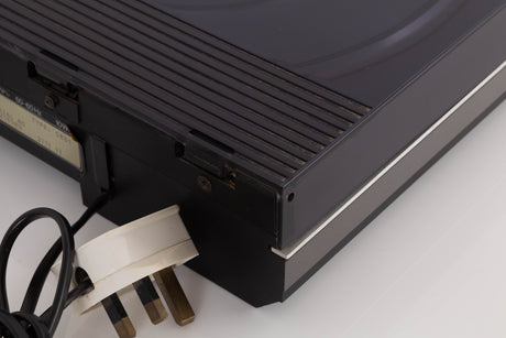Rear left corner of a used B&O Beogram RX2 Turntable