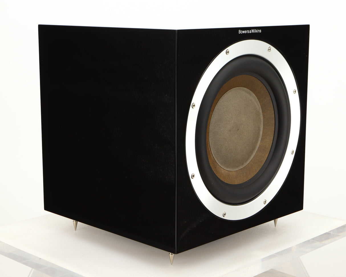 Front left corner of a used B&W ASW10CM Subwoofer in a gloss black finish