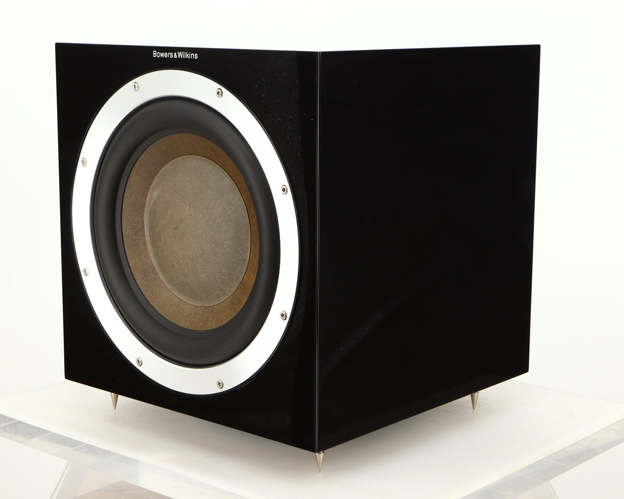 Front right corner of a used B&W ASW10CM Subwoofer in a gloss black finish