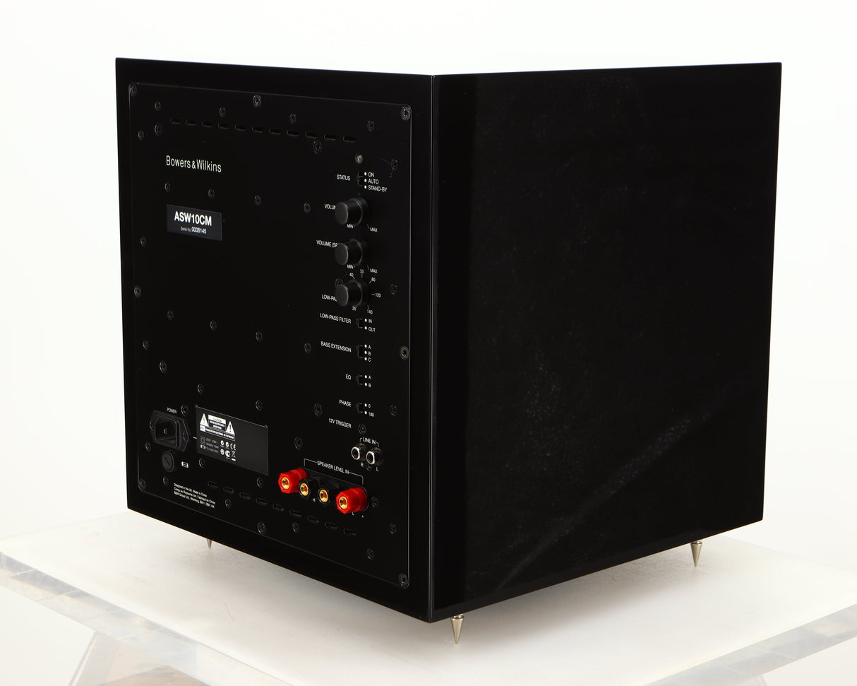 Rear left corner of a used B&W ASW10CM Subwoofer in a gloss black finish