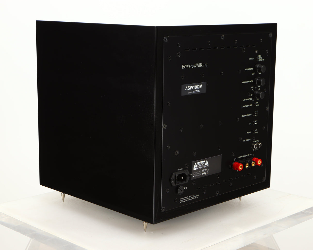 Rear right corner of a used B&W ASW10CM Subwoofer in a gloss black finish