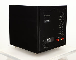 Rear right corner of a used B&W ASW10CM Subwoofer in a gloss black finish