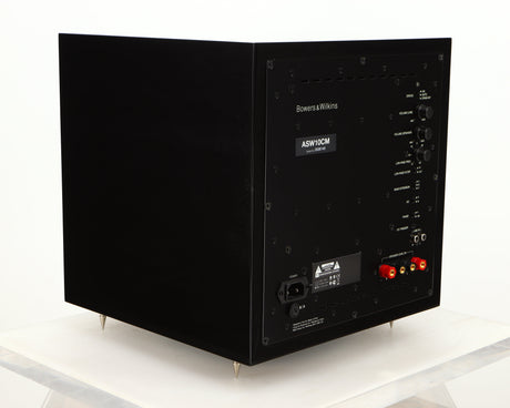 Rear right corner of a used B&W ASW10CM Subwoofer in a gloss black finish