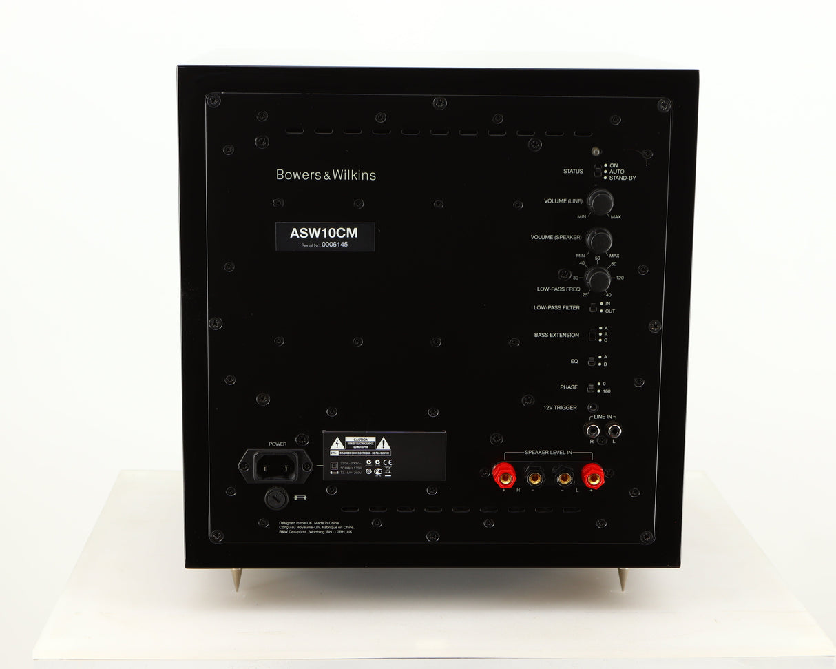 Rear view of a used B&W ASW10CM Subwoofer in a gloss black finish showing Mains Input and Speaker Level Inputs