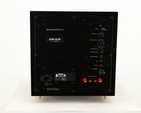 Rear view of a used B&W ASW10CM Subwoofer in a gloss black finish showing Mains Input and Speaker Level Inputs
