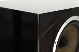 Close up of a used B&W CM Centre 2 Centre Speaker in a black gloss finish showing scratching on left side
