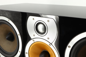 Close up of a used B&W CM Centre 2 Centre Speaker in a black gloss finish showing scratching on metal surround on tweeter