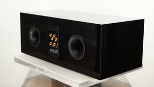 Rear left corner of a used B&W CM Centre 2 Centre Speaker in a black gloss finish