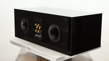 Rear left corner of a used B&W CM Centre 2 Centre Speaker in a black gloss finish