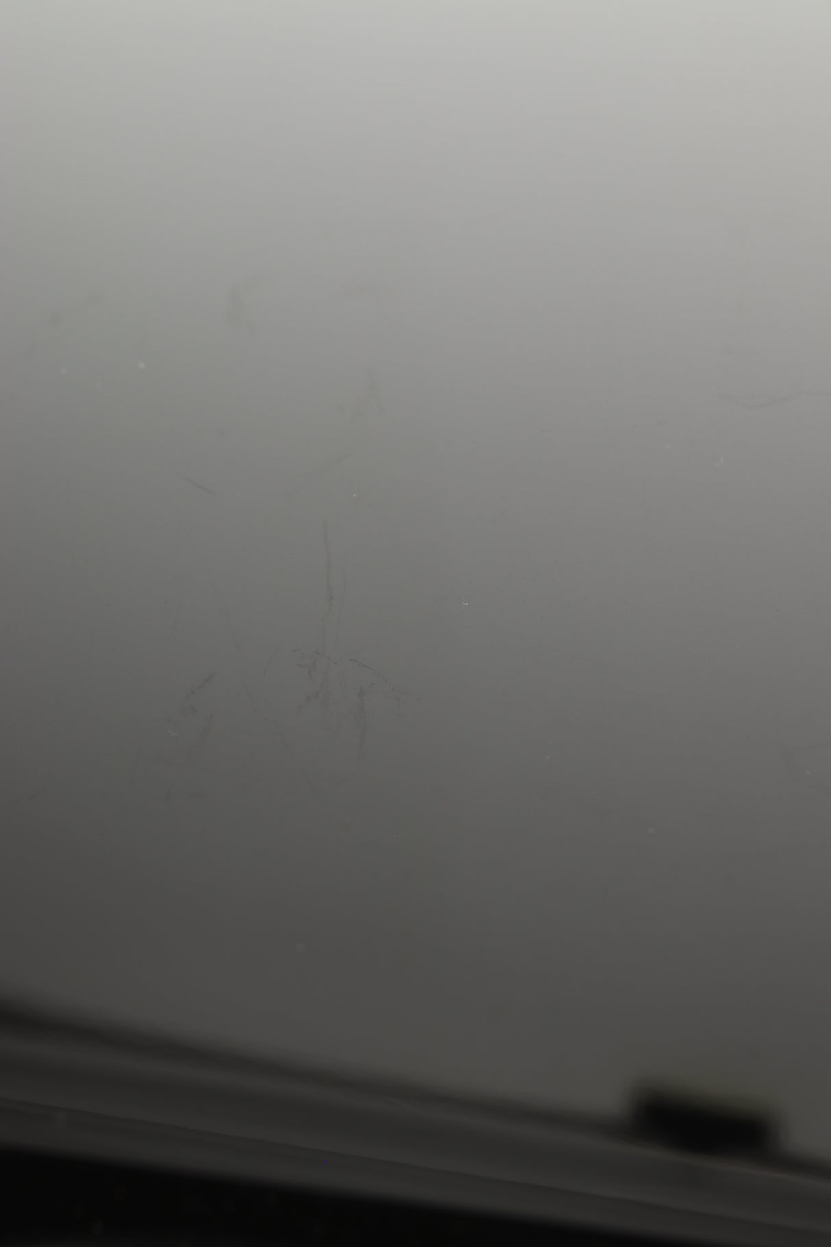 Close up view of a used B&W CM1 Standmount Speaker in Gloss Black finish showing some scratching 