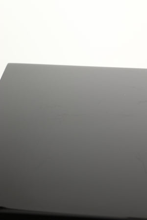 Close up view of a used B&W CM1 Standmount Speaker in Gloss Black finish showing some scratching 