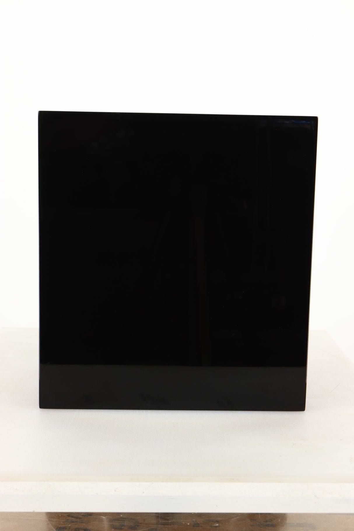 Side view of a used B&W CM1 Standmount Speaker in Gloss Black finish