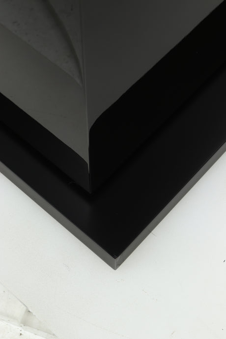 Close up of a used B&W CM8 S2 Floorstanding Speaker in a piano black finish showing some damage on the base