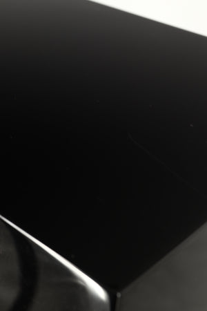 Close up of a used B&W CM9 S2 Floorstanding Speaker in a gloss black finish showing scratching on cabinet
