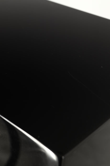Close up of a used B&W CM9 S2 Floorstanding Speaker in a gloss black finish showing scratching on cabinet