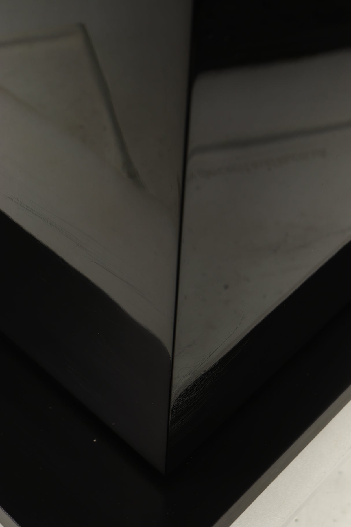 Close up of a used B&W CM9 S2 Floorstanding Speaker in a gloss black finish showing scratching on cabinet