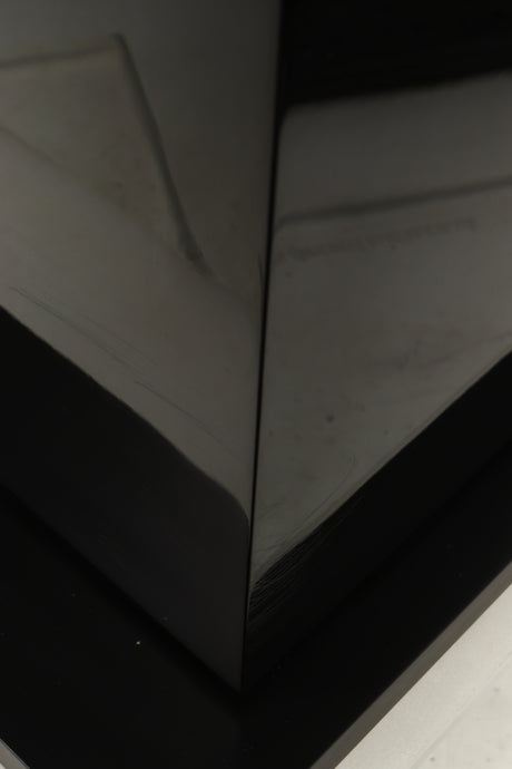 Close up of a used B&W CM9 S2 Floorstanding Speaker in a gloss black finish showing scratching on cabinet