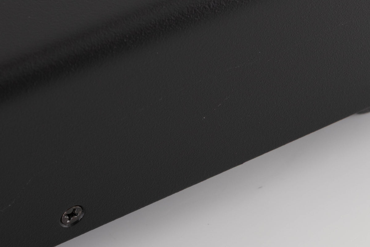Close up of a used Bel Canto PRe 3 Pre Amplifier showing scratches on left side