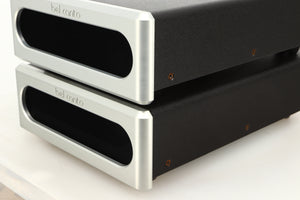 Front right corner view of a used pair of Bel Canto REF600M Monoblock Power Amplifiers in Silver finish