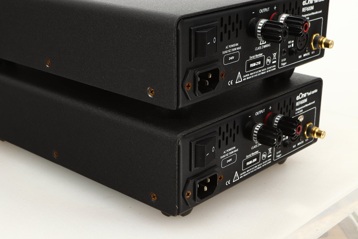 Rear left corner view of a used pair of Bel Canto REF600M Monoblock Power Amplifiers in Silver finish