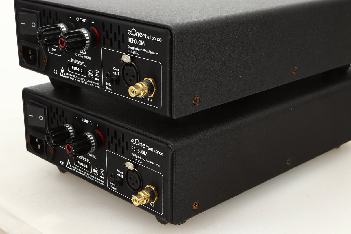 Rear right corner view of a used pair of Bel Canto REF600M Monoblock Power Amplifiers in Silver finish
